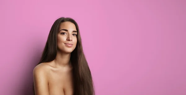 Portrait Handsome Pretty Young Woman Long Hair Empty Bright Pink Background.Beauty,Grooming,Fashion People Photo.Sexy Topless Girl Smiling Camera Studio Shot.Horizontal Wide Image.Soft Shadows Effect.