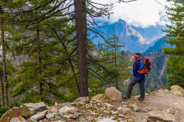 Young Sport Man Wearing Jacket Backpack Trail Mountains.Mountain Trekking Rocks Path Landscape Beautiful View Background.Woman Happy Smiling Close Rock.Horizontal Photo.