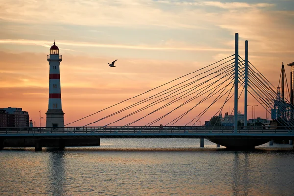 Lighthouse and bridge to Malmo at sunset