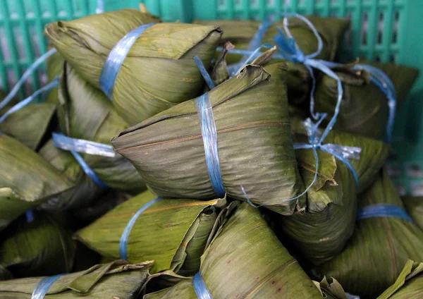 Chinese sticky rice dumplings, or zongzi, wrapped in bamboo leaves.