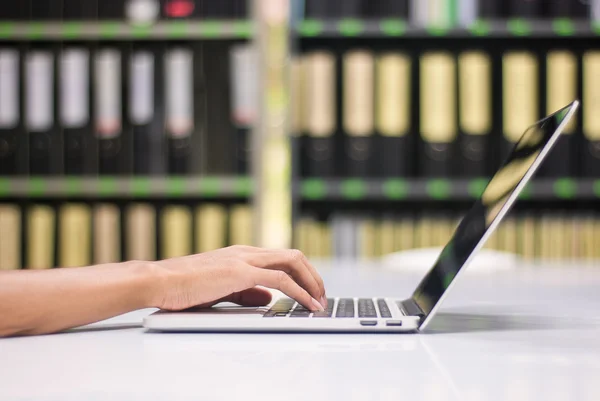 Man using laptop, side view