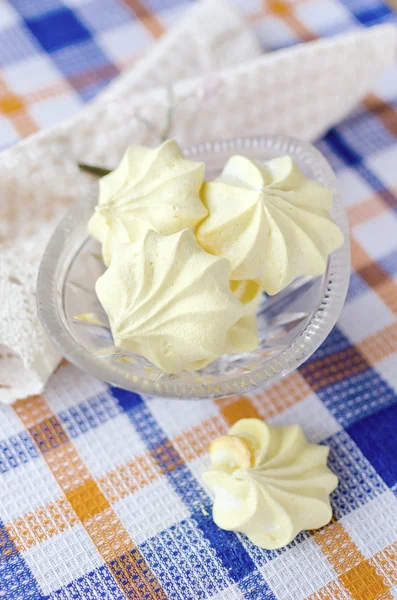 Yellow cookies in crystal vase.