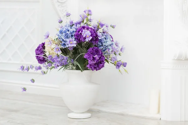 Flowers in a vase in an interior, a decor