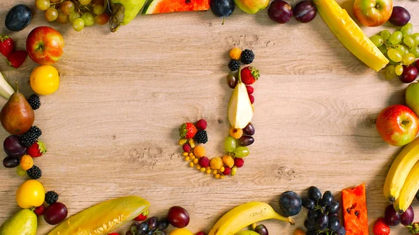 Fruits made letter J.  Alphabet made of fruits. Fruits are forming letters.