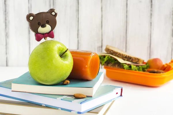 School lunch box with sandwich, fruits and nuts