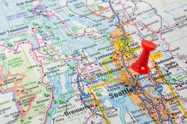 Red Pushpin Highlighting Seattle on an Road Map