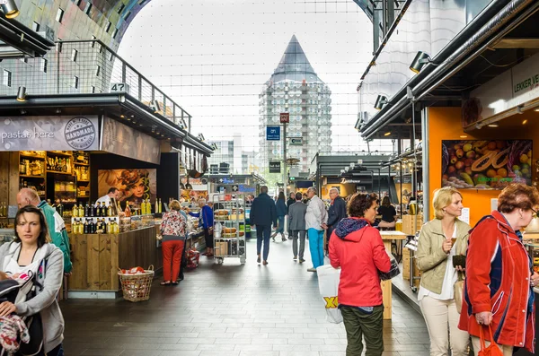 Interior of the Market Hall in Rotterdam with People Wandering around the Shops