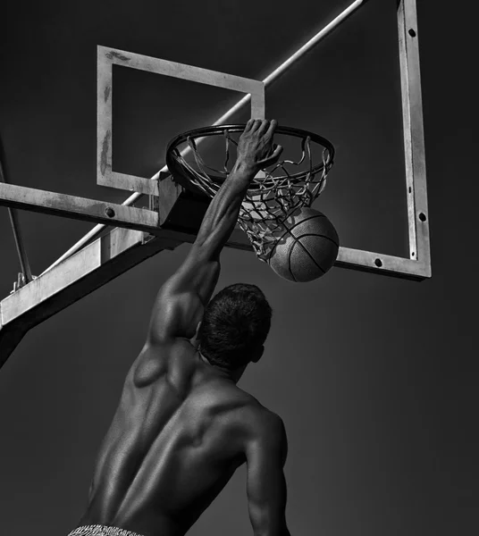 Sport. Basketball player in action -- black and white toned phot