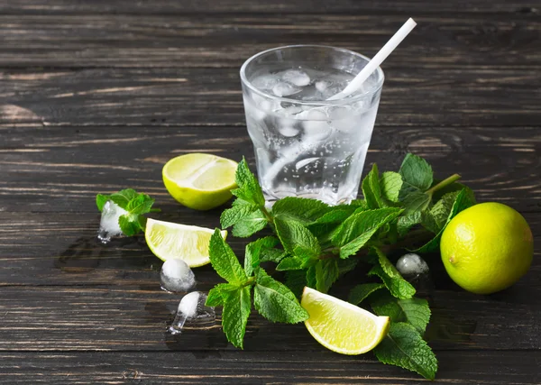 Cocktail with soda water, ice, lime and mint