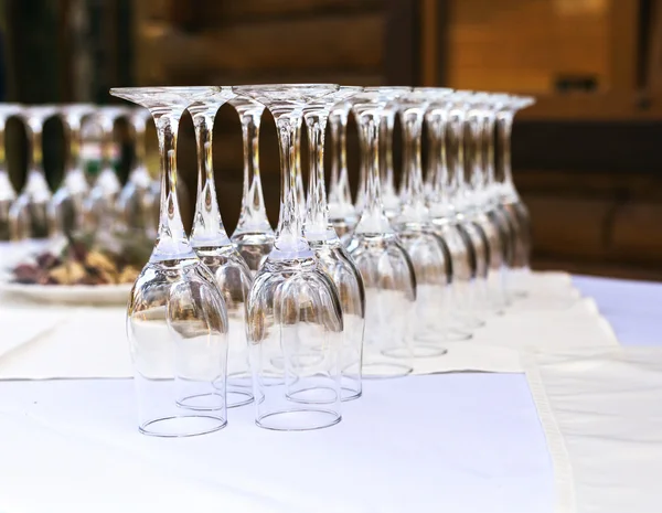 The line of empty stemware at the table in restaurant