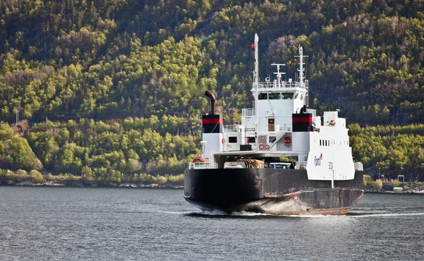 SOGNEFJORD, NORWAY - 12 MAY 2012: Gas powered ferry Sogn of Fjord1 shipping company moves passengers across Sognefjord, 12 may 2012, Sognefjord, Norway