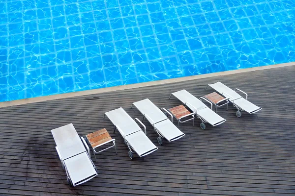 Sunloungers in the swimming pool terrace