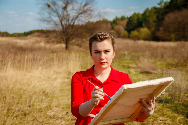 Artist painting a landscape