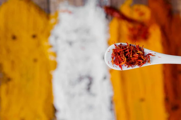 Various spices selection Saffron, turmeric, curry. different dry spices on a wooden background.