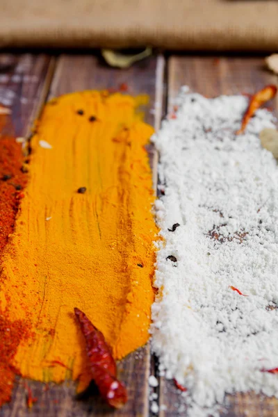 Various spices selection Saffron, turmeric, curry. different dry spices on a wooden background.