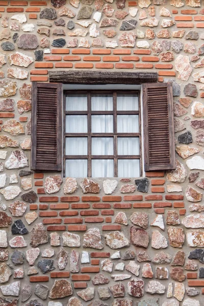 Brick building, wood windows in brick building.