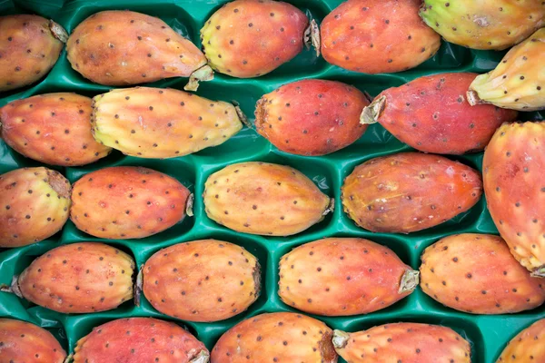 Fruits of prickly pear cactus on a market.
