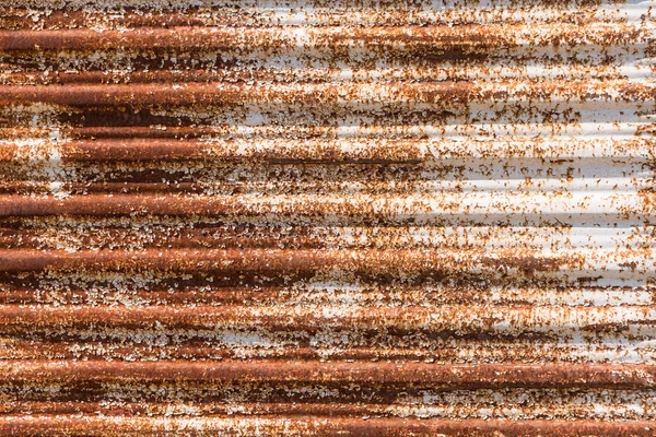 Close up of a rusty corrugated iron. Rusty corrugated iron background.