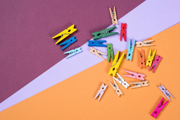 A lot of colorful clothes pegs for scrapbooking, design or decor.