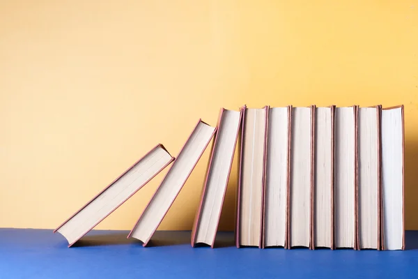 Stack of colorful books on table. Education background. Back to school. Copy space for text.