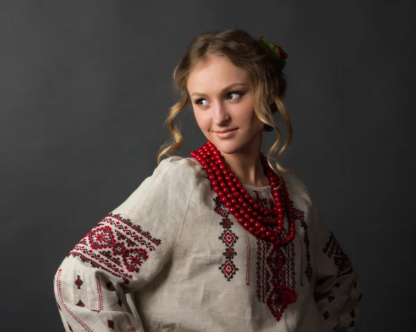 Beautiful happy cute young woman in Ukrainian embroidery