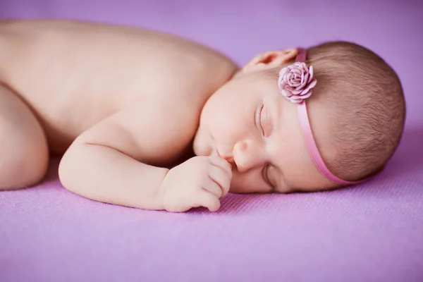 Sleeping newborn baby girl.