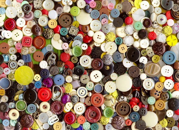 Lot of multicolor plastic old vintage different clothing buttons pattern background