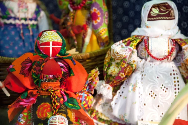 Russia, Khabarovsk - May 1, 2016: Traditional Russian rag doll at Slavic culture fair. Handmade art textile faceless toy girl souvenir market