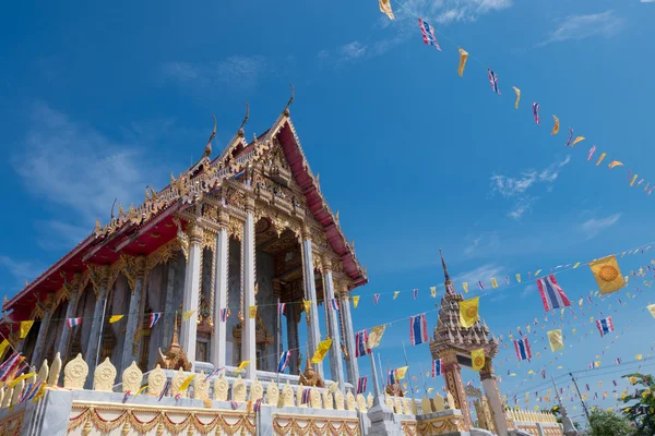 Samutprakarn, Thailand - July 19: Thai Buddhist decorate temple with Thailand flag and yellow Buddhism symbol flag to celebrating on Asalha Puja day or Asalha bucha Day before Khao Phansa day.