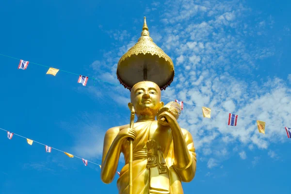Samutprakarn, Thailand - July 19; Thai Buddhist decorate temple and Statue with Thailand flag and yellow Buddhism symbol flag to celebrating on Asalha Puja day or Asalha bucha Day before Khao Phansa day.