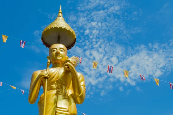 Samutprakarn, Thailand - July 19; Thai Buddhist decorate temple and Statue with Thailand flag and yellow Buddhism symbol flag to celebrating on Asalha Puja day or Asalha bucha Day before Khao Phansa day.