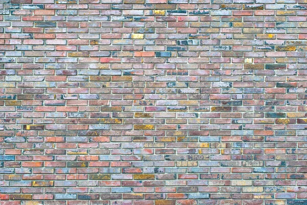 A brick wall colored mosaic