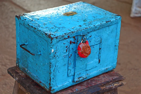 Blue donation box. Red wax seal