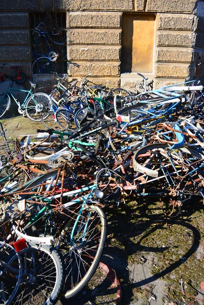 Dump the old broken rusty bicycles in the open air at sunny day