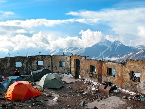 Tent camp in the destroyed walls of the hotel \