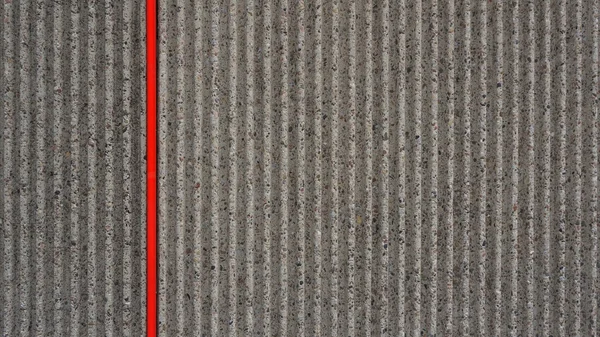 Abstract background grey concrete wall with red stripe