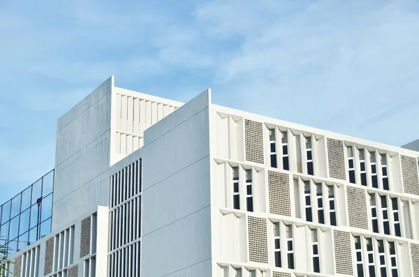 A corner roof of a white building