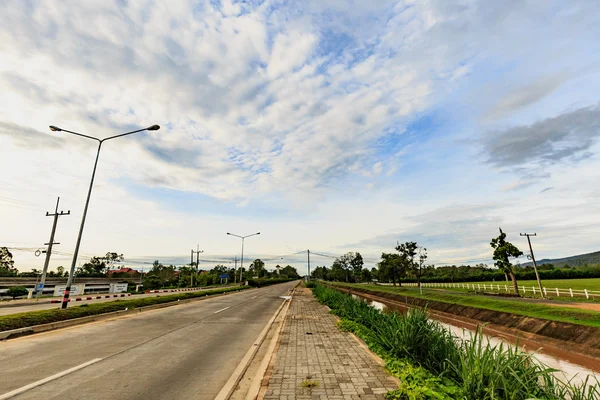 Asphalt road Highway Empty road clouds and sky sun rises