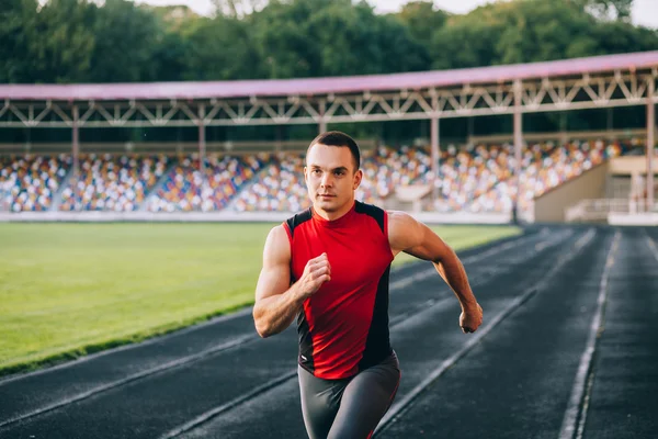 Runner on the track at a sport stadium