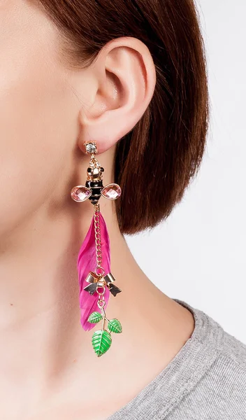 Earrings with feathers, bugs and leaves