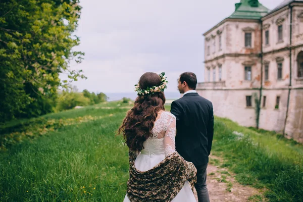 Newlyweds by the old castle