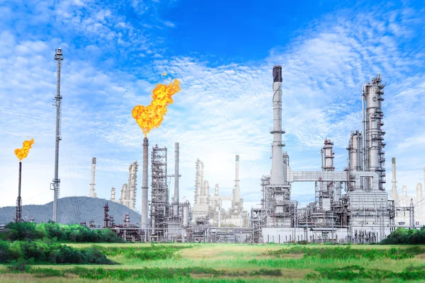 Oil and gas refinery plant with with flare stack on blue sky background