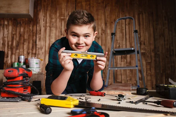 Child builder for construction work concept, funny boy builder