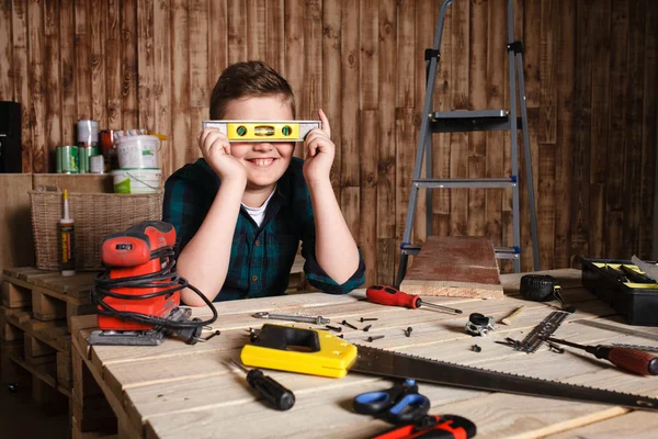 Child builder for construction work concept, funny boy builder