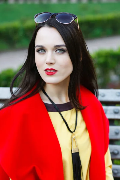 Beautiful elegant woman on the street looks