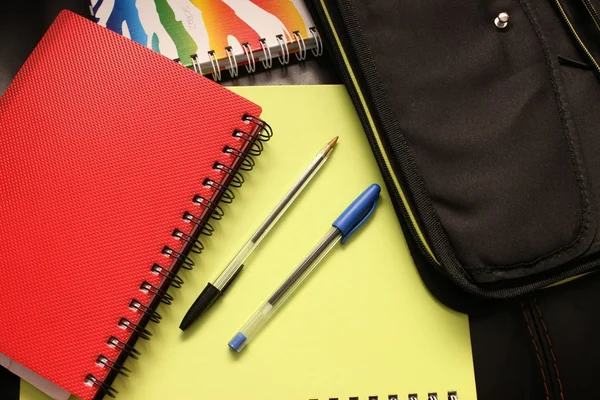 Notepads with pens. Back to school equipments