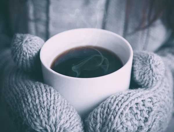 Cup of Coffee in Gray Mittens