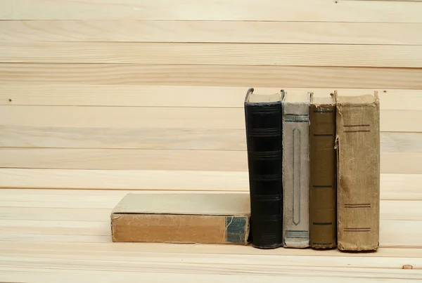 Pile of books. Hardback books on wooden table. Knowledge is important. Copy space