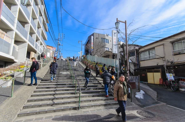 Tokyo, Japan - January 27, 2016: Yuyake dandan.it is the stairs on the slope road to Yanaka-Ginza street.view from the head of the stairs is popular. We can see Yanaka-Ginza street and beautiful sunset