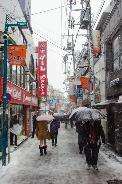 Tokyo, Japan - February 8, 2014 : Shimokitazawa district with snow.is famous for independent fashion shops, cafes, decorations, and theaters.